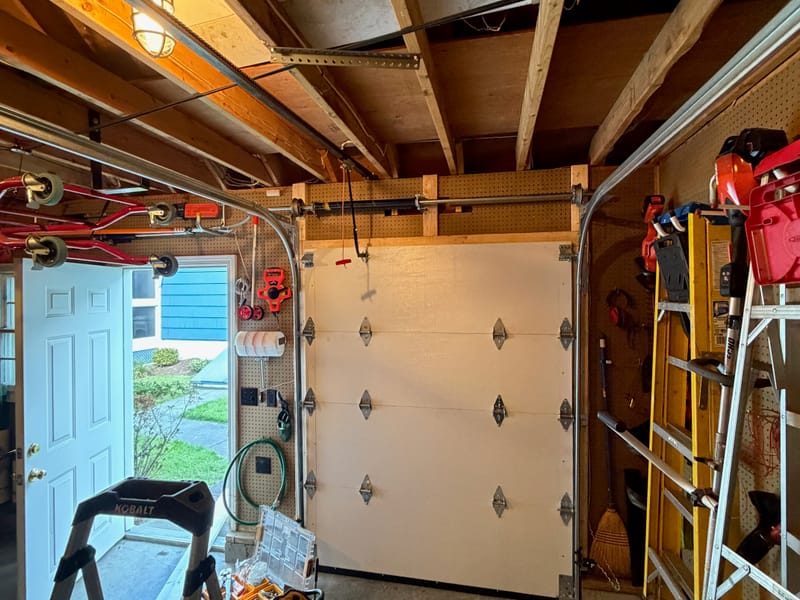 Inside the Chelmsford garage: the new 66-inch flush-panel door running on its new tracks
