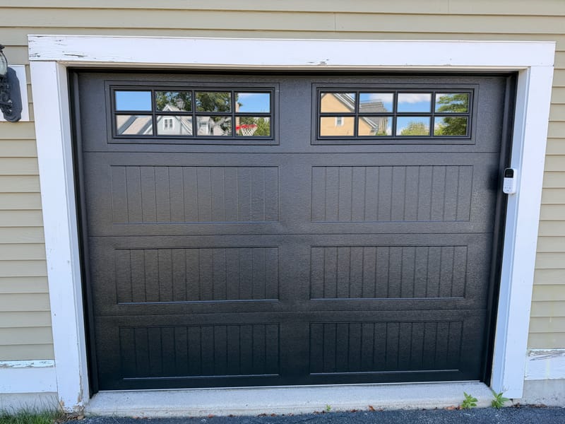 Black long-panel garage door with Stockton windows in North Andover, MA